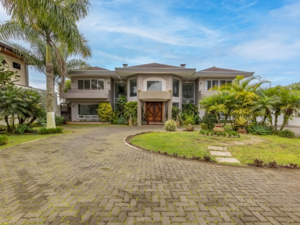 Landscape view of Las Palmeras Luxury Residence in San Ramon, showcasing the expansive estate and lush surroundings, ideal for buyers interested in luxury real estate in Costa Rica.