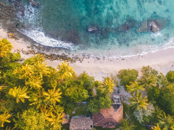Coastline in Costa Rica with a charming house amidst nature, epitomizing the allure of real estate investment and development.